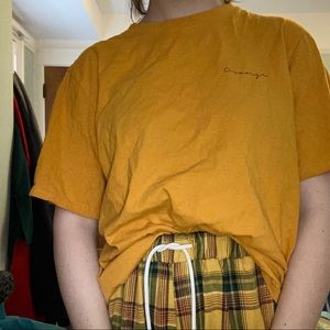 orange lettered t-shirt